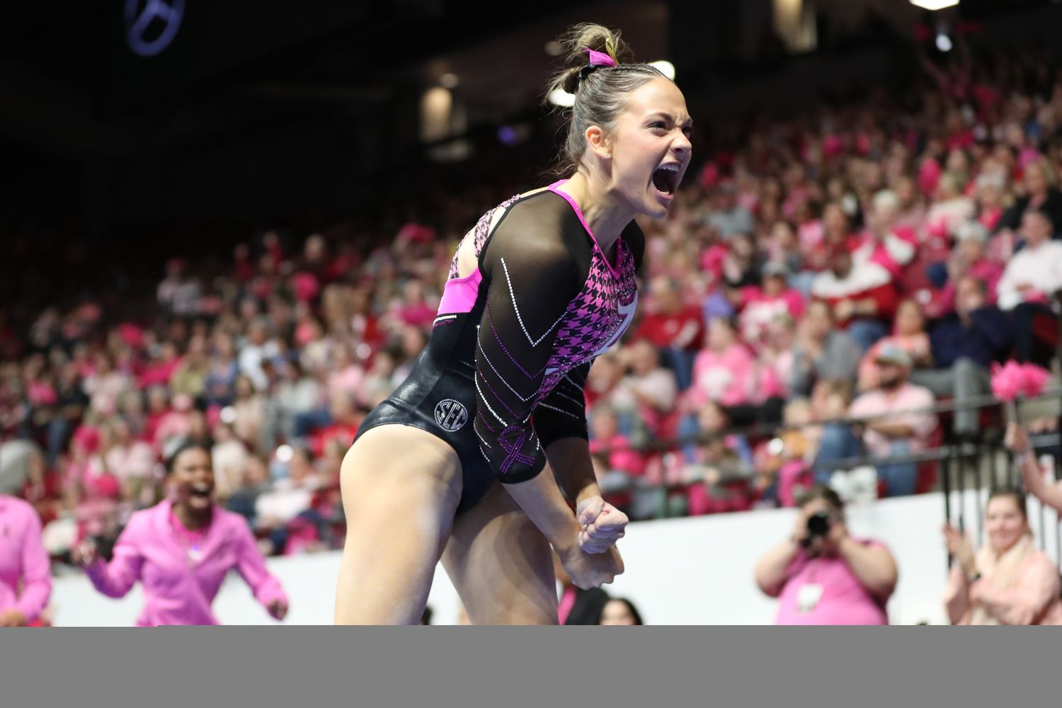 Gabby Gladieux on floor in Power of Pink meet